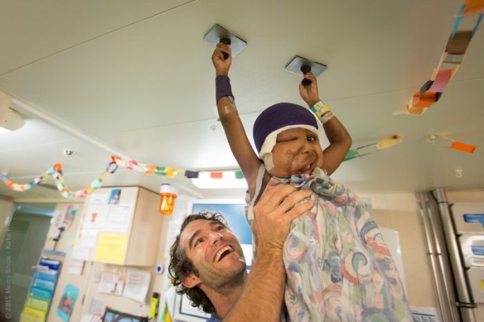 ©2015 Mercy Ships - Photo Credit Katie Keegan - Ward Nurse Brian DREBERT (CAN) with a patient in the wards
