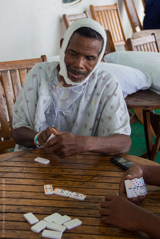 ©2016 Mercy Ships - Photo Credit Catrice Wulf - Thomas (MGC09548) plays dominoes on Deck 7.